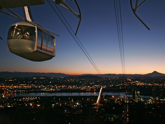 One of the two cars in the new aerial tram rises above Portland, Oregon, at sunrise. (Reuters/Richard Clement)
