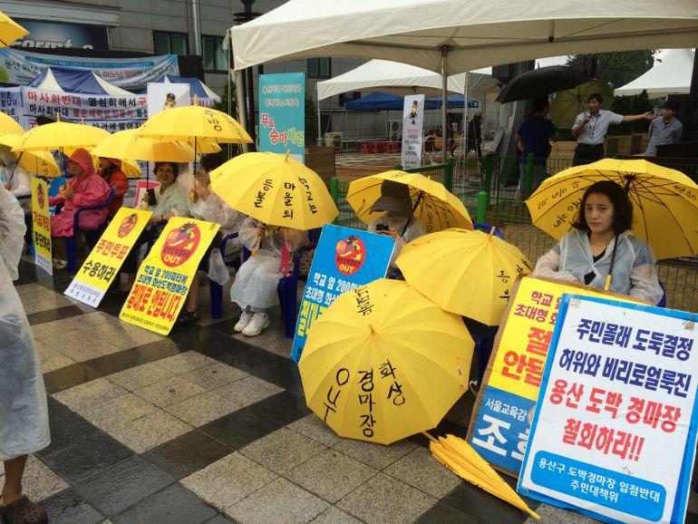 Sacred Heart sisters, school teachers, parents and students maintain daily protests adjacent to the Korean Racing Authority building. (Tom Fox)