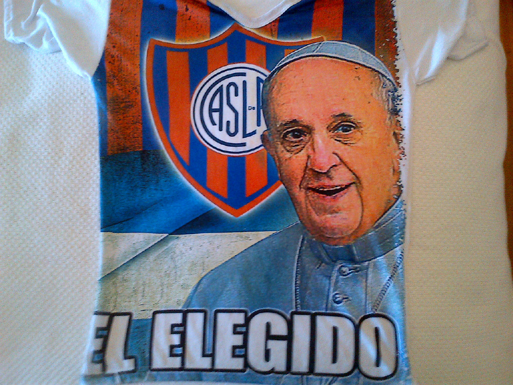 A t-shirt sold on the streets of Buenos Aires, showing Pope Francis with the colors of the San Lorenzo soccer team