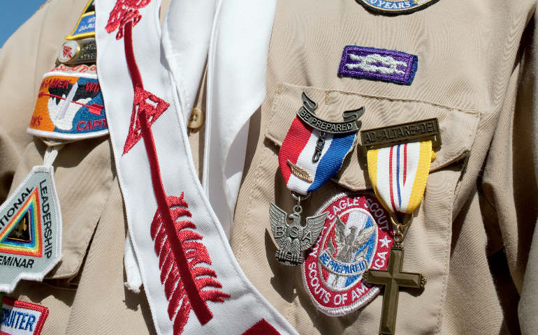 Among the awards displayed on this Scout's uniform are the Order of the Arrow sash, the Eagle Scout medal and badge, and the Catholic "Ad Altare Dei" ("to the altar of God") medal. (CNS/Nancy Phelan Wiechec)