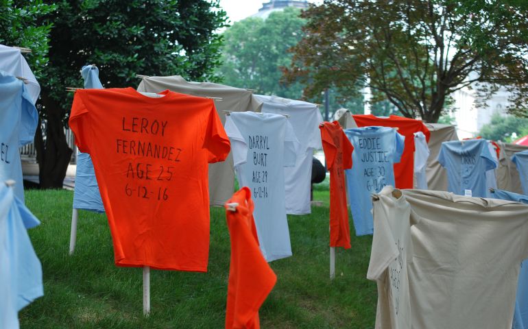A traveling exhibit of T-shirts outside the United Methodist building near the U.S. Capitol in Washington, D.C., commemorates the 58 victims of the Pulse Nightclub and Mother Emanuel church shootings. The display is part of a partnership between Faiths United to Prevent Gun Violence and Heeding God's Call, two faith-based movements to end gun violence. (Courtesy of the General Board of Church and Society of the United Methodist Church)