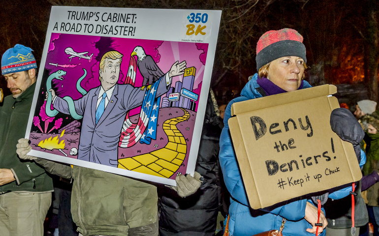 Hundreds of New Yorkers gather in front of Sen. Charles Schumer's residence in Brooklyn Jan. 9, calling on him to oppose nominations of climate-change deniers to President-elect Donald Trump's administration. (Newscom/Sipa USA/Erik McGregor)