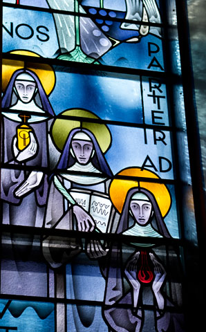 A window in the Mount St. Scholastica Chapel depicts three Benedictine saints: from left, Walburga, Hildegard and Gertrude. (Courtesy of Mount St. Scholastica)