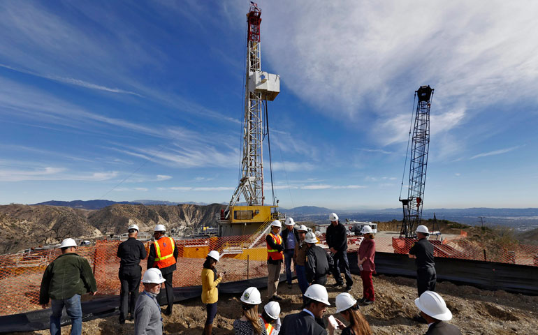 At Southern California Gas Company’s Aliso Canyon facility in Porter Ranch on Dec. 2, 2015, Los Angeles Mayor Eric Garcetti and company officials look at the drilling of a relief well to stem a natural gas leak at an adjacent well in an underground storage field. (Newscom/EPA/Irfan Khan)