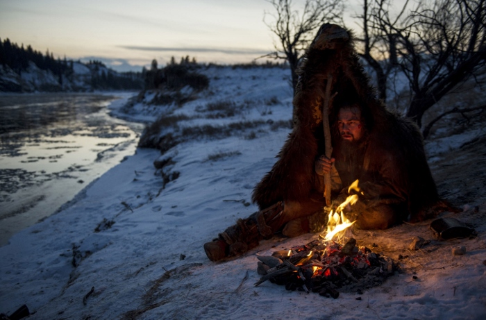 Hugh Glass (Leonardo DiCaprio) struggles to stay warm during a vicious winter in "The Revenant." (Copyright © 2015 Twentieth Century Fox Film Corporation)