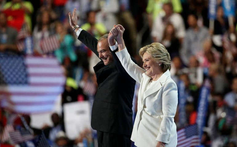 Democratic presidential nominee Hillary Clinton waves with her vice presidential running mate Sen. Tim Kaine after accepting the nomination on the fourth and final night at the Democratic National Convention in Philadelphia, Pa., July 28, 2016. (Photo courtesy REUTERS/Gary Cameron)