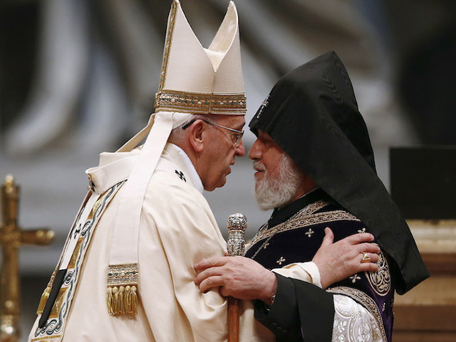 Pope Francis embraces Catholicos of All Armenians Karekin II during a mass on the 100th anniversary of the Armenian mass killings, in St. Peter's Basilica at the Vatican April 12, 2015. (Reuters/Tony Gentile)
