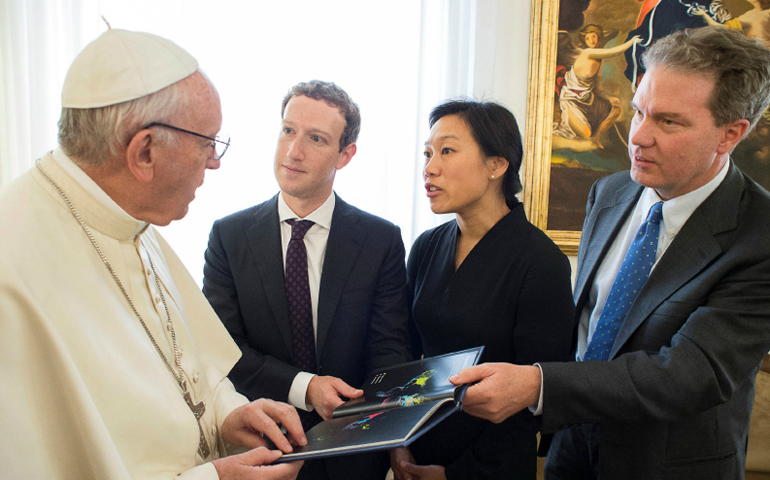 Pope Francis talks to Mark Zuckerberg, second from left, and Priscilla Chan, Zuckerberg's wife, at the Vatican on Aug. 29. Vatican spokesman Greg Burke is at far right. (Photo courtesy of Reuters via L'Osservatore Romano)