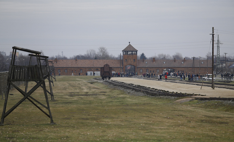 Visitors gather on the grounds of the former Nazi German concentration and extermination camp Auschwitz-Birkenau near Oswiecim, Poland January 27, 2016, to mark the 71st anniversary of the liberation of the camp by Soviet troops and to remember the victims of the Holocaust. (Reuters/Kacper Pempel)