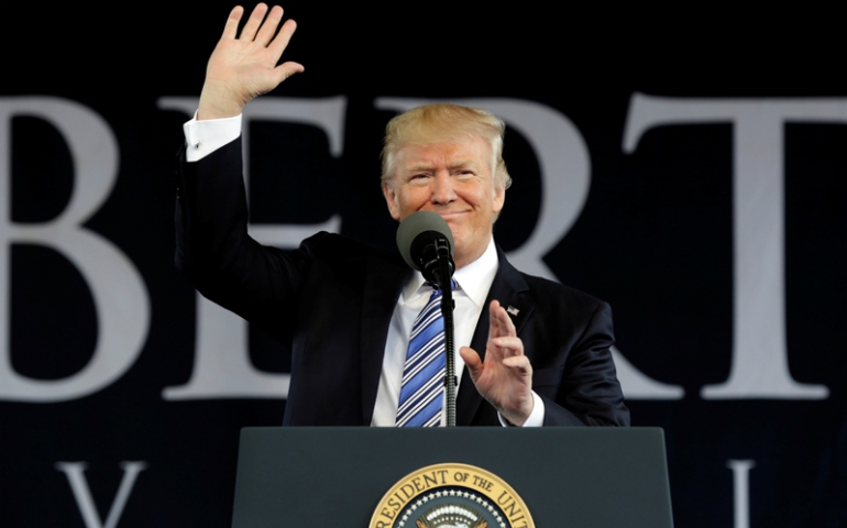 President Donald Trump waves before delivering keynote address at Liberty University's commencement in Lynchburg, Va., on May 13, 2017. (REUTERS/Yuri Gripas)