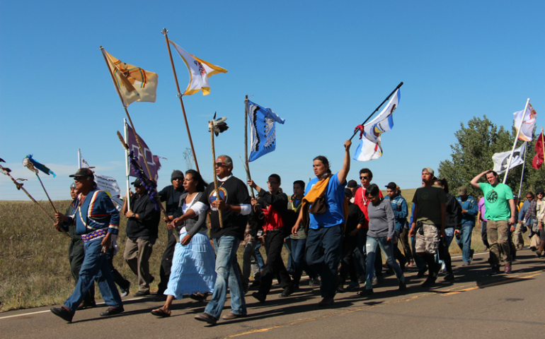 Several hundred people took part in a prayer walk on Sept. 14, 2016, from the Oceti Sakowin camp near Standing Rock Reservation in North Dakota to the site up the road where Dakota Access began digging over Labor Day weekend for construction on a nearly 1,200-mile pipeline project. Construction temporarily has been halted. (RNS/Emily McFarlan Miller)