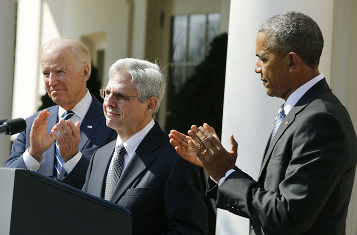 President Obama applauds Judge Merrick Garland, center, of the United States Court of Appeals as his nominee for the U.S. Supreme Court as Vice President Joe Biden, left, joins in at the Rose Garden of the White House in Washington on March 16, 2016. (Reuters/Jonathan Ernst)