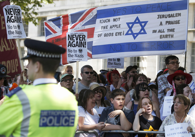 People of multiple faiths hold a counterprotest to an anti-Shomrim protest that was held to demonstrate against Britain’s Jewish community in Westminster, London, on July 4, 2015. (Reuters/Peter Nicholls)