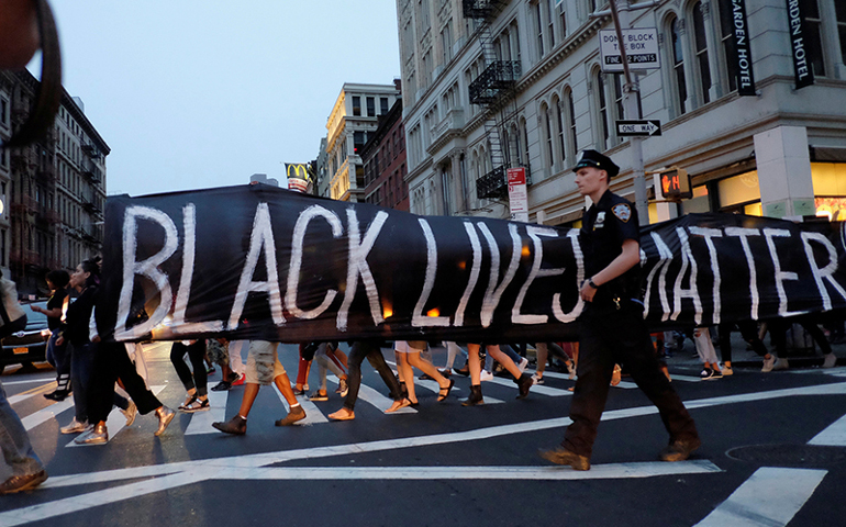 People take part in a protest against police brutality and in support of Black Lives Matter during a march in New York City on July 9, 2016. Photo courtesy of Reuters/Eduardo Munoz/File Photo