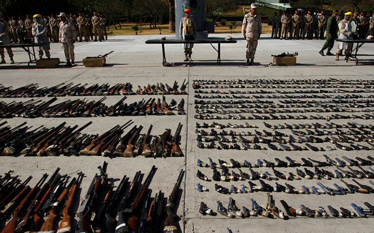 Weapons seized from criminal gangs are displayed Aug. 12 at a base in Tijuana, Mexico. (Photo courtesy of REUTERS/Jorge Duenes)