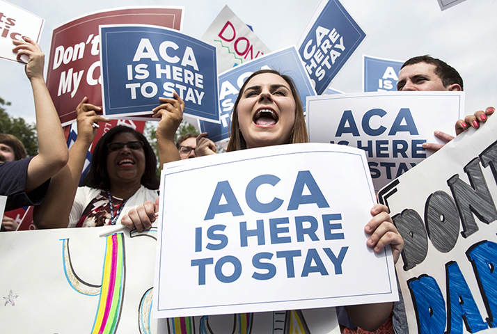Supporters of the Affordable Care Act celebrate after the Supreme Court up held the law in the 6-3 vote at the Supreme Court in Washington on June 25, 2015. (Reuters/Joshua Roberts)