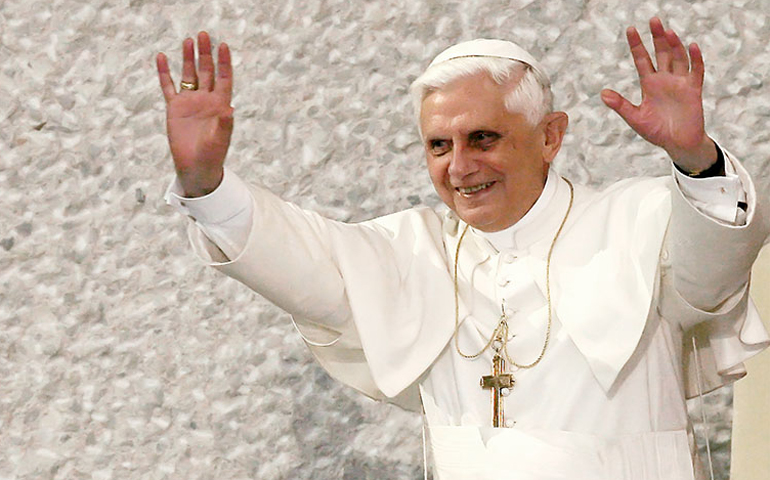 Pope Benedict XVI greets the crowd at the Vatican in this 2004 file photo. (Photo courtesy of Reuters/Alessandro Bianchi)