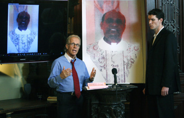 Attorneys Jeff Anderson, left, and Mike Finnegan, attorneys for the accusers, discuss correspondence between a Minnesota bishop and the Vatican relating to a criminal charge against Catholic priest Fr. Joseph Jeyapaul for two counts of criminal sexual conduct in the United States in 2004 and 2005, from their law office in St. Paul, Minnesota, on April 5, 2010. (Reuters/Eric Miller)