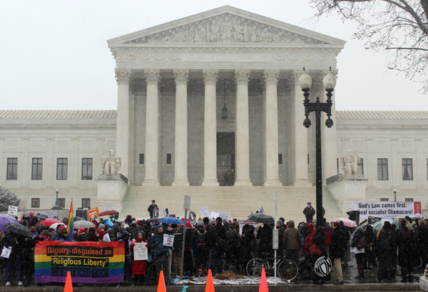 Demonstrators gathered outside the Supreme Court March 25 as it considered a case in which businesses challenged the contraception mandate of the Affordable Care Act. (RNS photo/Adelle M. Banks)