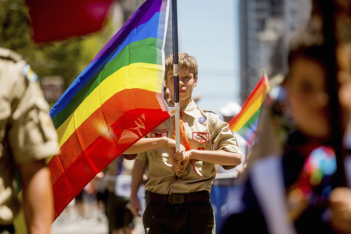 Boy Scout Casey Chambers carries a rainbow flag during the San Francisco Gay Pride Festival in California on June 29, 2014. (Reuters/Noah Berger)