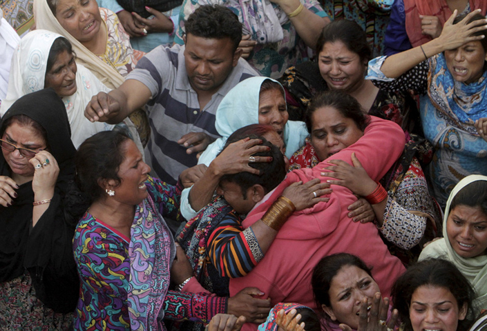 Family members mourn the death of a relative, who was killed in a blast outside a public park on Sunday, during a funeral in Lahore, Pakistan, on March 28, 2016. (Reuters/Mohsin Raza)