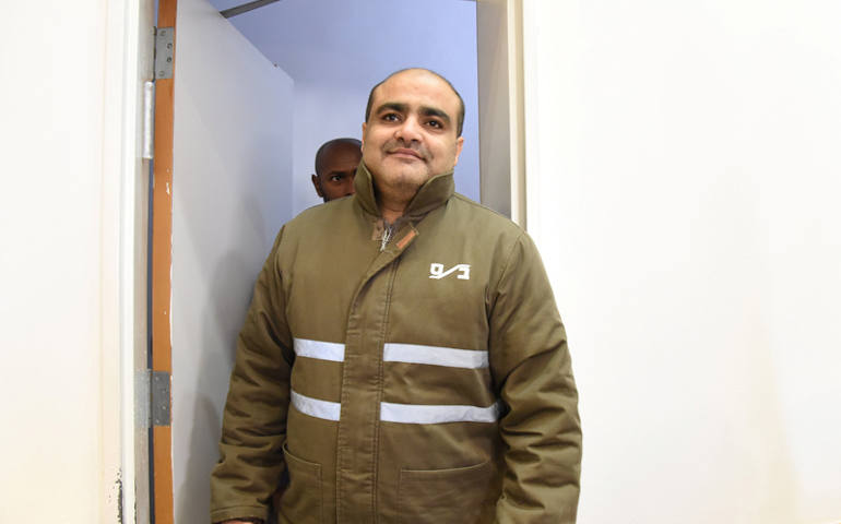 Palestinian Mohammad El Halabi, front, a manager of operations in the Gaza Strip for U.S.-based Christian charity World Vision, is seen before a hearing at the Beersheba district court in southern Israel on Aug. 4, 2016. Halabi is accused by Israel of funneling millions of dollars in aid money to Hamas in Gaza, a charge denied by the Islamist militant group. (Photo courtesy of REUTERS/Dudu Grunshpan)