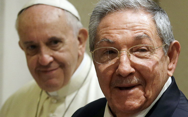 Cuban President Raul Castro, right, smiles as he meets Pope Francis during a private audience at the Vatican on May 10, 2015. (REUTERS/Gregorio Borgia/pool)