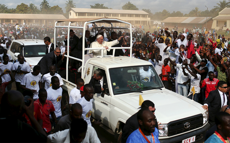 A crowd greets Pope Francis as he visits residents in the capital Bangui, Central African Republic, on Nov. 30, 2015. (Reuters/Siegfried Modola)