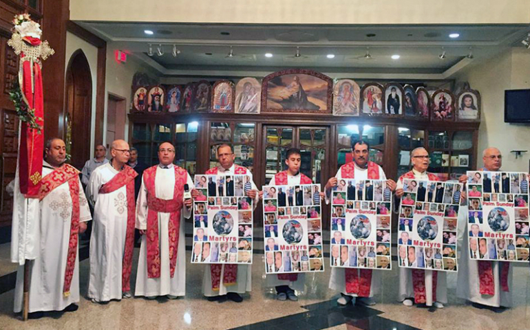 Coptic clergy hold signs to remember victims of the Palm Sunday attack in Egypt during a service at the Church of Virgin Mary and St. Athanasius on April 18, 2017, in Mississauga, Ontario, near Toronto. (Hira Hyder)