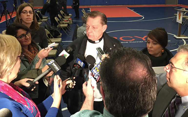 The Rev. Michael Pfleger speaks to reporters following the announcement of an anti-violence initiative in Chicago, Illinois, on April 4. (RNS/Tom Gallagher)