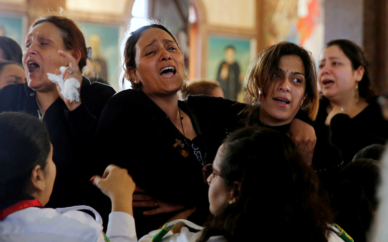 Relatives react as they mourn for the victims of the Palm Sunday bombings during their funeral at the Monastery of St. Mina (Deir Mar Mina) in Alexandria, Egypt, on April 10, 2017. (Reuters/Amr Abdallah Dalsh)