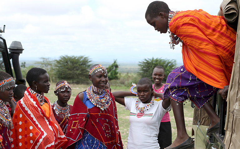Maasai girls arrive for the start of a social event advocating against harmful practices such as female genital mutilation at the Imbirikani Girls High School in Imbirikani, Kenya, on April 21, 2016. (Photo courtesy of Reuters/Siegfried Modola)