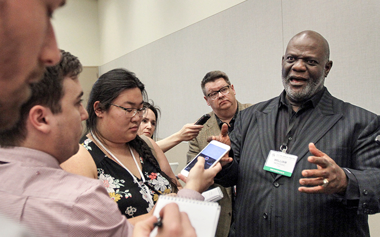 The Rev. Dwight McKissic, pastor of Cornerstone Baptist Church in Arlington, Texas, speaks with reporters after a resolution similar to one he submitted June 13 on racism was unanimously approved June 14, 2017. Messengers adopted a resolution "on the anti-Gospel of alt-right white supremacy." (Photo courtesy of Baptist Press/Van Payne)