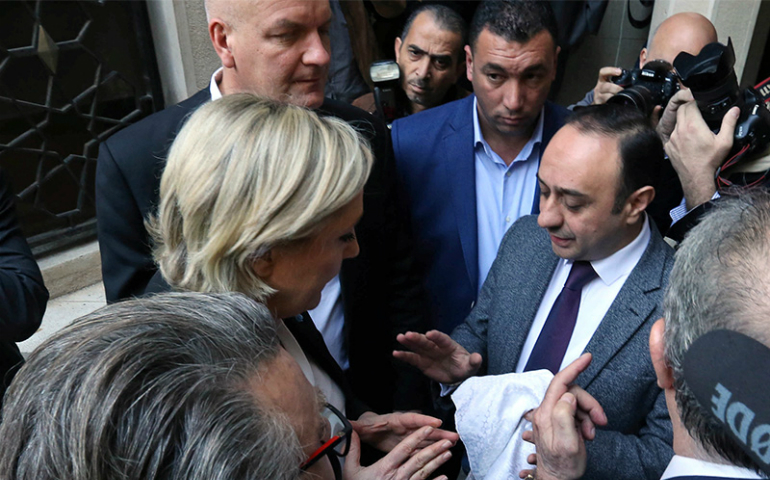 Marine Le Pen, French National Front (FN) political party leader and candidate in the French 2017 presidential election, refuses a headscarf for her meeting with Grand Mufti Sheikh Abdellatif Deriane in Beirut, Lebanon, on Feb. 21, 2017. (Reuters/Aziz Taher)