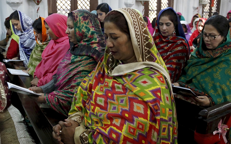 Christian women worship together at a Mass at All Saints Church in Peshawar, Pakistan, on Dec. 25, 2015. (Courtesy of Reuters/Khuram Parvez)