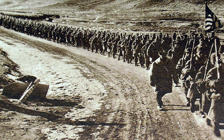 American troops walking along a road during World War I. (Creative Commons)