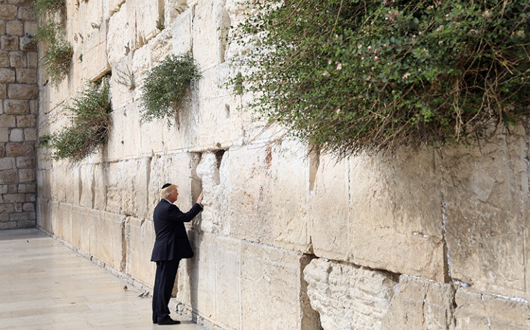 President Trump touches the Western Wall, Judaism's holiest prayer site, in Jerusalem's Old City on May 22, 2017. (Courtesy of Reuters/Ronen Zvulun)