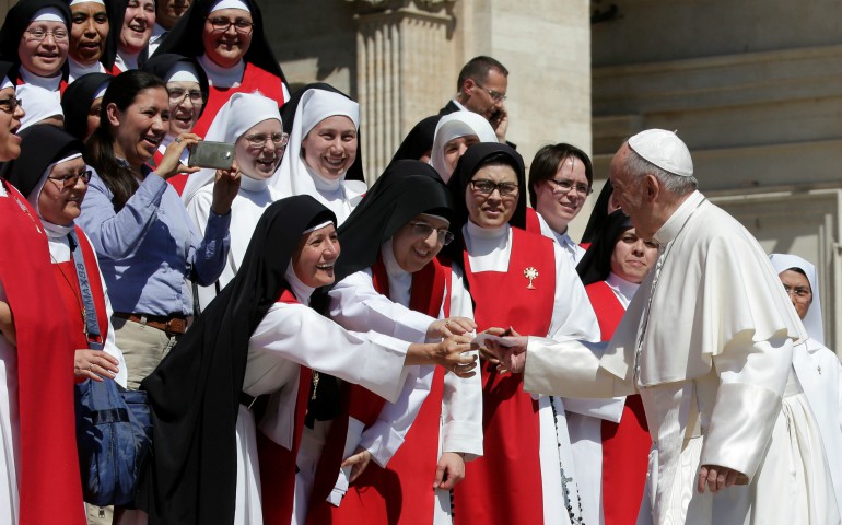 Pope Francis greets a group of nuns as he arrives for his general audience in St. Peter's Square May 17 at the Vatican. (CNS photo/Max Rossi, Reuters)