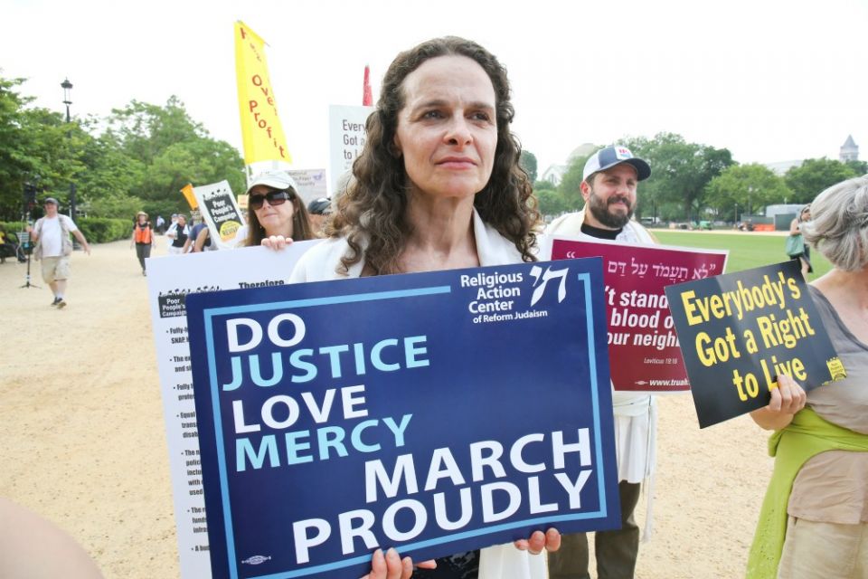 Rabbi Jennie Rosenn, founder and CEO of Dayenu: A Jewish Call to Climate Action, takes part in a demonstration on the National Mall in Washington, D.C. (Courtesy of the Religious Action Center of Reform Judaism) Rabbi Jennie Rosenn, founder and CEO of Dayenu: A Jewish Call to Climate Action, takes part in a demonstration on the National Mall in Washington, D.C. (Courtesy of the Religious Action Center of Reform Judaism)