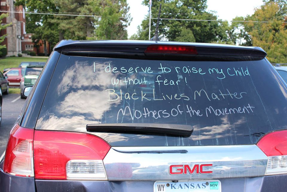 Writing on a car window supports Black Lives Matter in 2016 in a parking lot at a Donnelly College, a Catholic institution in Kansas City, Kansas. (NCR photo/Toni-Ann Ortiz)