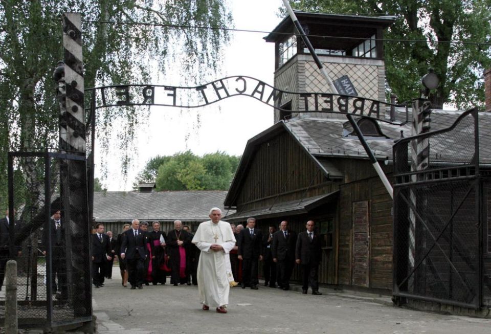 Pope Benedict XVI walks through the gate of Auschwitz, in this May 28, 2006, file photo. (CNS/Reuters/Pawel Kopczynski)