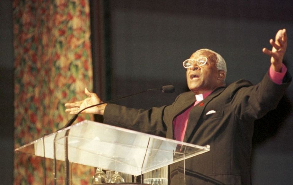 Anglican Archbishop Desmond Tutu addresses the Catholic Charities USA conference in Rochester, N.Y., in 1999. (CNS/Catholic Courier/Mike Mergen)
