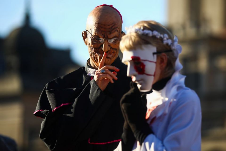 Activists dressed as clergymen and their victims protest the institutional church's protection of sex offenders in Krakow, Poland on Dec. 6, 2020. (ZUMA Press/NurPhoto/Beata Zawrze)