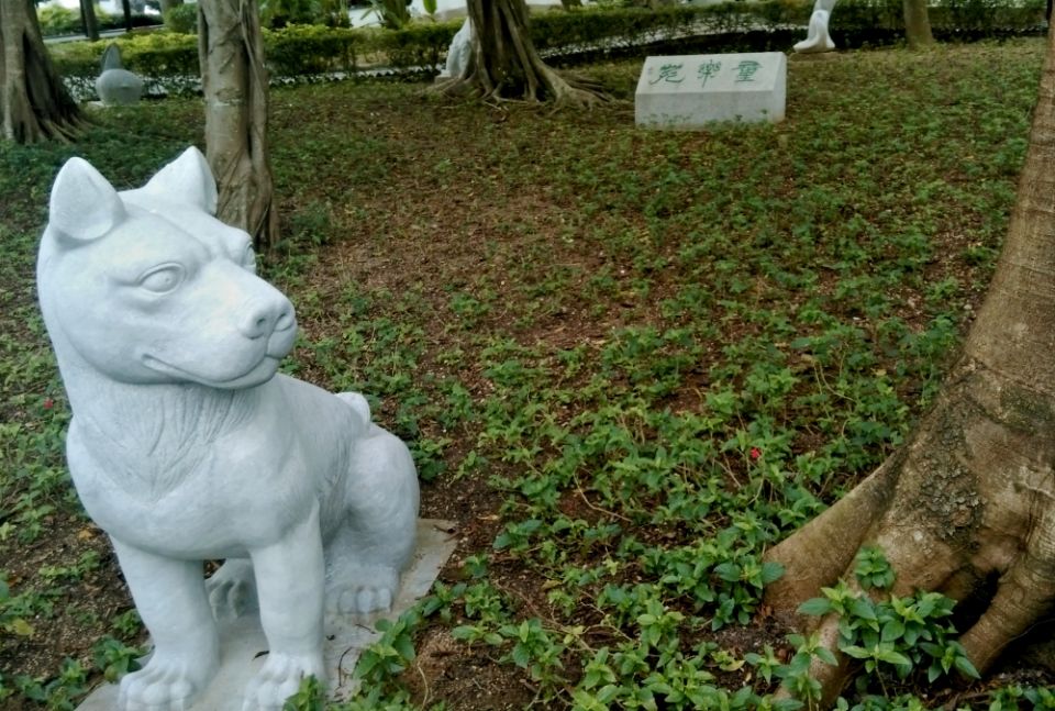 A dog is among 12 statues representing the Chinese zodiac in a park in Kowloon City, Hong Kong. (Wikimedia Commons/Yd712015)
