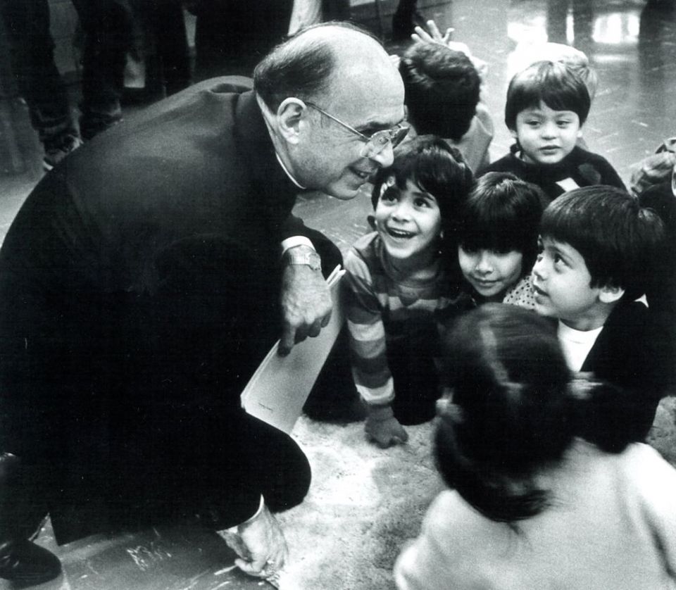 The late Chicago Cardinal Joseph L. Bernardin is pictured with children in an undated photo. (CNS/courtesy John H. White)