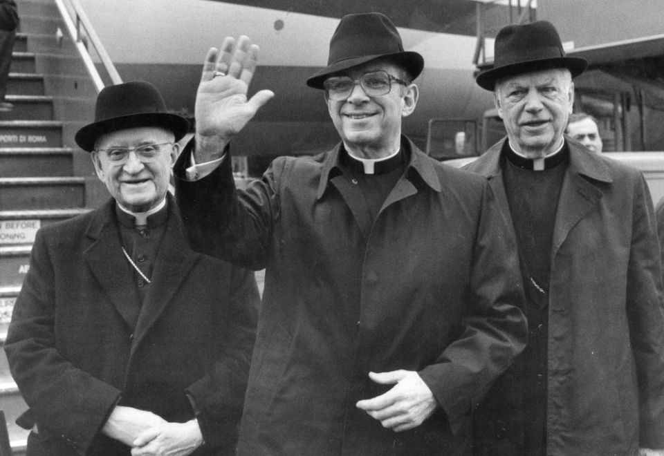 Cardinal Joseph L. Bernardin, archbishop of Chicago, waves upon arriving at Rome's Leonardo Da Vinci airport in this Jan. 30, 1983, file photo. In December 1983 he delivered a lecture outlining a "consistent ethic of life." (AP/Massimo Sambucetti)