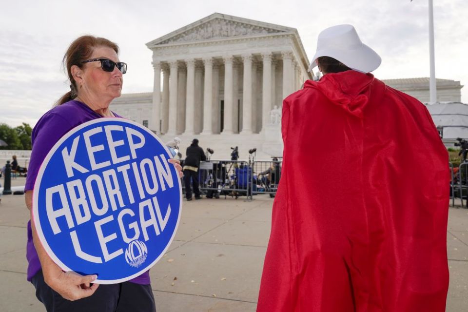 Abortion-rights activists demonstrate outside the Supreme Court Oct. 4. Arguments are planned for December challenging Roe v. Wade and Planned Parenthood v. Casey. (AP/J. Scott Applewhite)