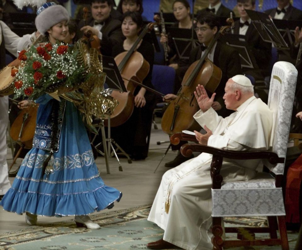 Pope John Paul II blesses a singer following a performance in Astana, Kazakstan, in September 2001. The late pope was on a six-day visit to Kazakstan and Armenia. (CNS/Reuters)