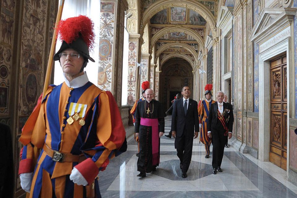 Swiss Guards and Vatican officials accompany President Barack Obama as he arrives for his meeting with Pope Benedict XVI at the Vatican July 10, 2009. (CNS/L'Osservatore Romano via Reuters)