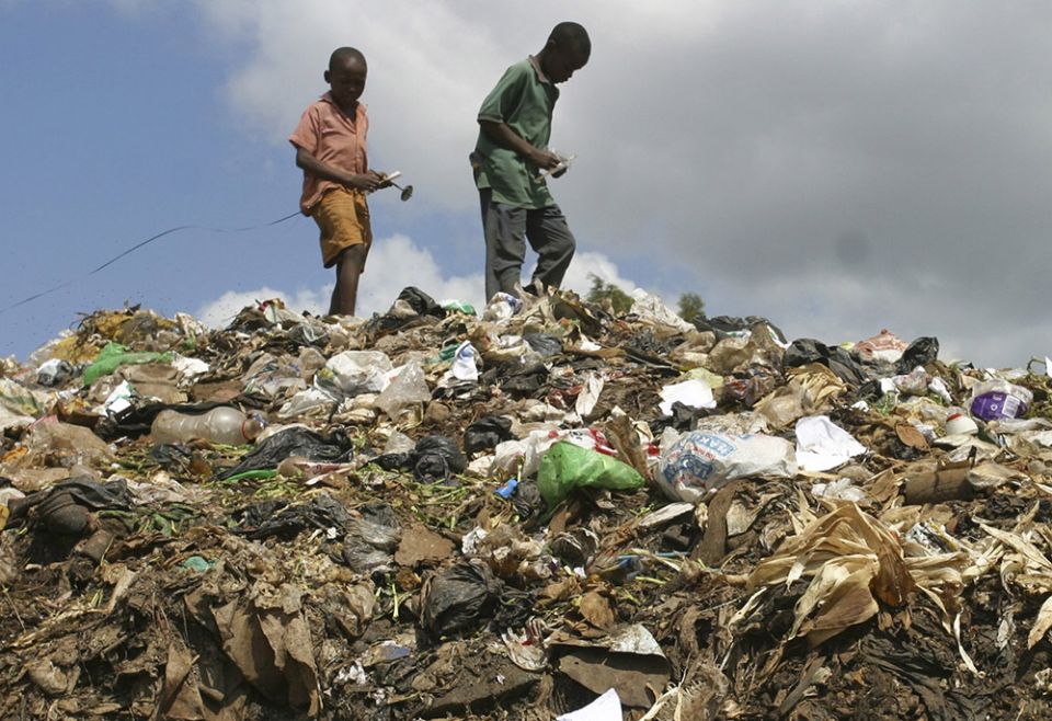 Children from a slum area scavenge through a garbage dump in Nairobi, Kenya, in late February 2009. (CNS/Reuters/Noor Khamis) Children from a slum area scavenge through a garbage dump in Nairobi, Kenya, in late February 2009. (CNS/Reuters/Noor Khamis)